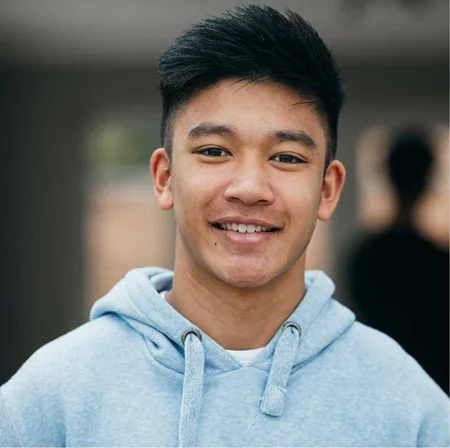 Teenager smiling after their orthodontic treatment